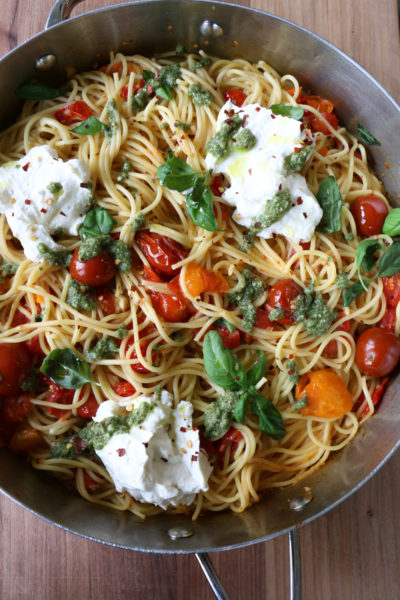 Spaghetti with Ricotta and Tomatoes! Creamy, flavorful and so delicious! This one comes together in under 30 minutes and is absolutely delicious. The ricotta makes the pasta creamier and the pesto takes the entire dish up a notch in my opinion. Mix everything together and it's heaven. Hope you try it!