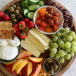 Burrata Cheese Board with nectarines and roasted tomatoes. Make something easy and special to snack on. Enjoy with friends and family. 