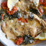 Creamy Tuscan Chicken! Succulent and flavorful chicken bathed in a creamy, cheesy rich sauce. Enjoy this alone, or with pasta, bread or roasted potatoes.