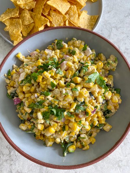 Mexican Street Corn Salad. Esquites inspired recipe! Grilled corn, everything but the elote seasoning, cilantro, jalapeño peppers and more!