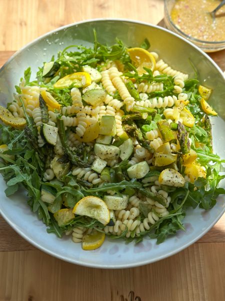 Spring Pasta Salad with Roasted Vegetables, arugula and a delicious homemade dressing! So easy to make and perfect for brunch or lunch, we hope you try it!