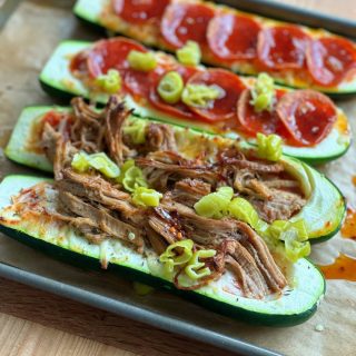 Easy Stuffed Zucchini Boats! Filled with tomato sauce, mozzarella cheese and pepperonis and pulled pork! Great low carb option!