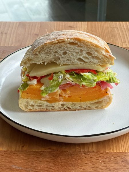 Roasted Butternut Squash Sandwich! Layers of roasted butternut squash, provolone, hot peppers, lettuce, tomato, onion, mayo, oil and vinegar.