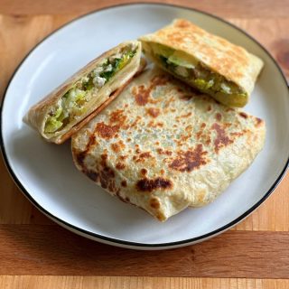 Chicken Caesar Salad Wrap! Everything you love about a caesar salad in wrap form. Chicken, lettuce, tomatoes and a delicious dressing.