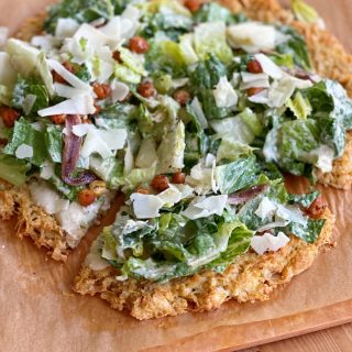 Viral Chicken Crust Caesar Salad Pizza!! Can you believe this pizza crust is made from chicken?! Grain free, high protein and so delicious!