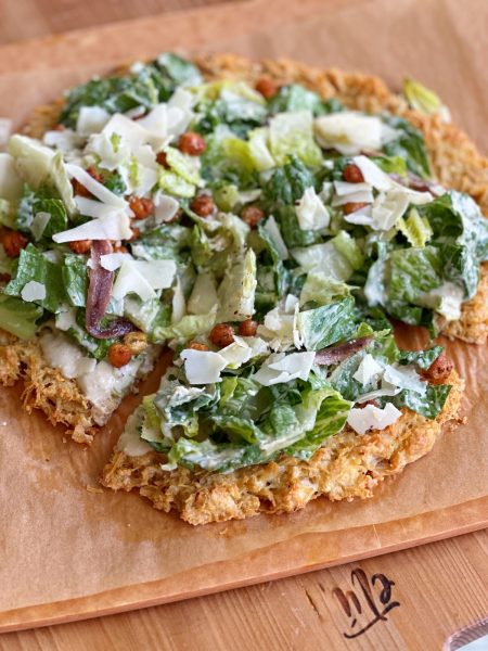Viral Chicken Crust Caesar Salad Pizza!! Can you believe this pizza crust is made from chicken?! Grain free, high protein and so delicious!