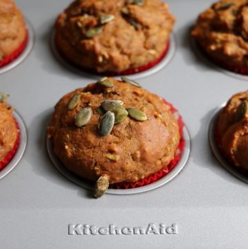 Pumpkin Muffins! Delicious muffins with pepitas, pumpkin pie spice, cinnamon and more! Your house will be filled the aroma of fall!