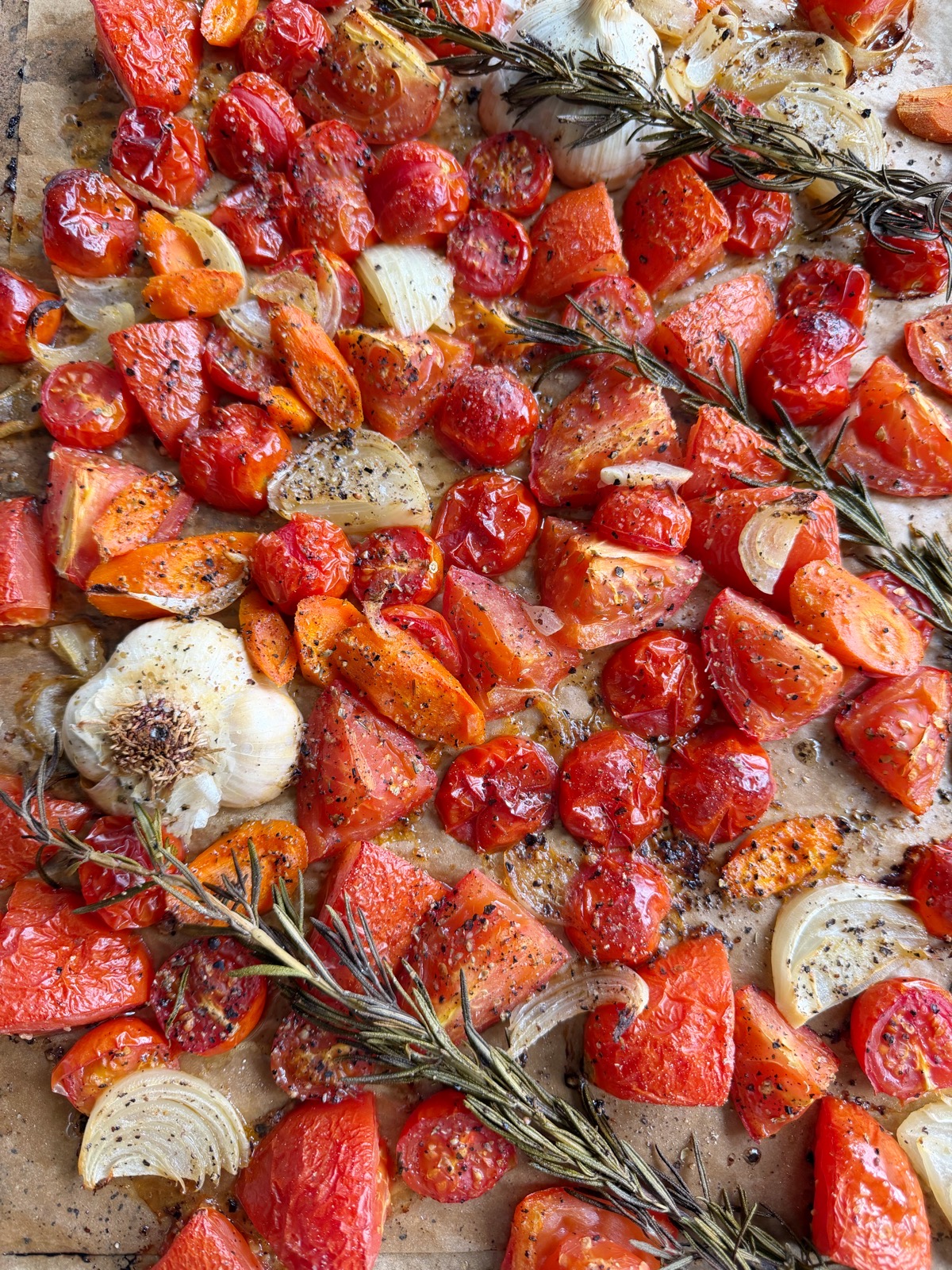 Roasted Tomato Soup made from roasting Roma and cherry tomatoes, onions, carrots and more! It's so rich in flavor and super simple to make!