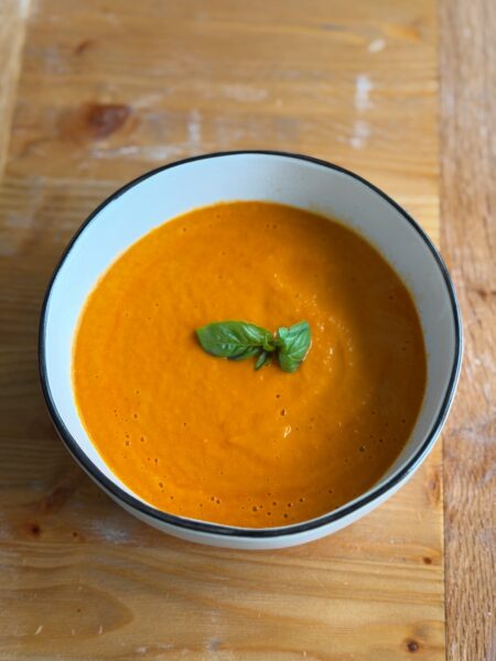 Roasted Tomato Soup made from roasting Roma and cherry tomatoes, onions, carrots and more! It's so rich in flavor and super simple to make!